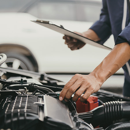 mechanic-inspecting-a-car-engine